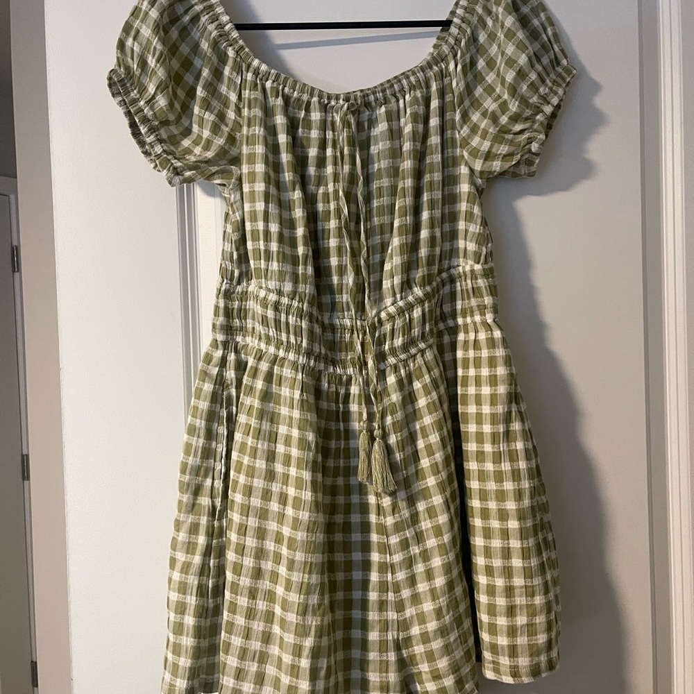Two sage dresses